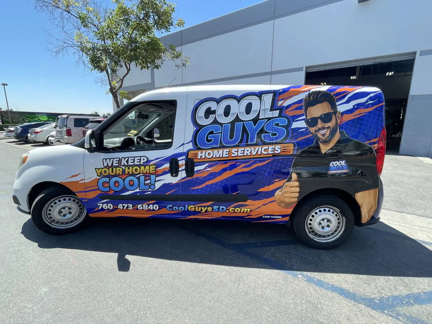 A wrapped Cool Guys Home Services van, phone number and CoolGuysSD.com on the door